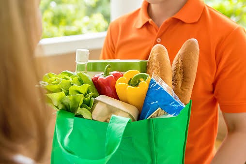 Food delivery man with a bag of food