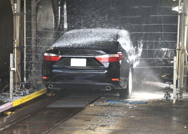 Car sprayed with water at car wash