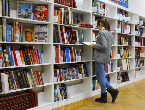 A woman reading book in the library