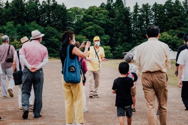 A tour guide showing tourists around