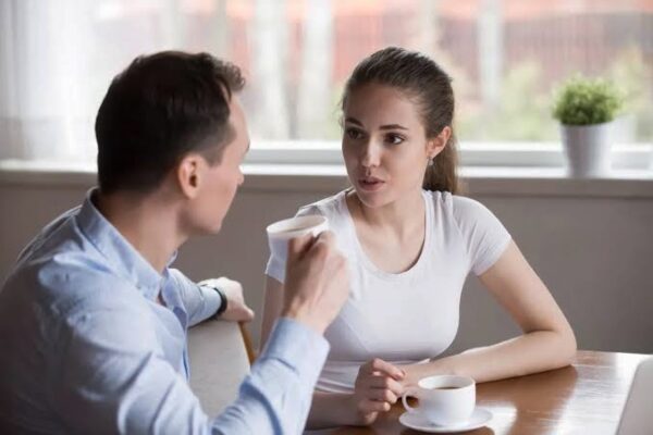 Couple discussing budgeting expenses. 